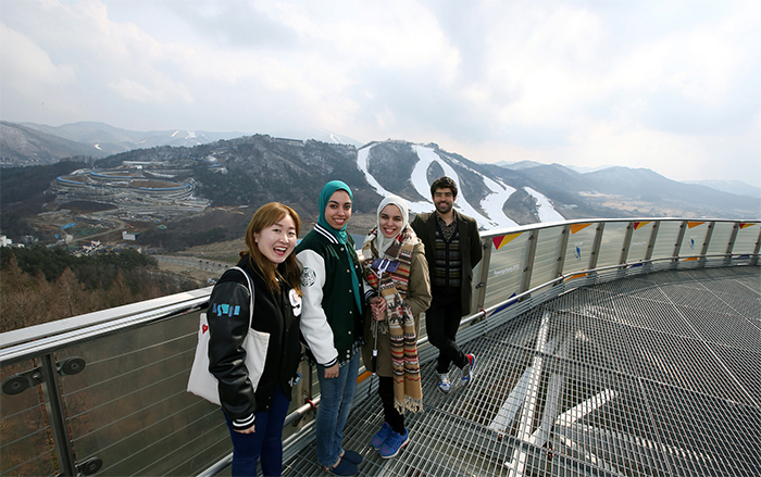 At the Ski Jump Stadium, visitors walk over a see-through floor at the top of the ski run.