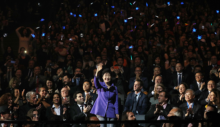 President Park Geun-hye waves to the audience during a K-pop concert, part of KCON France 2016, at the Accor Hotels Arena in Paris on June 2.