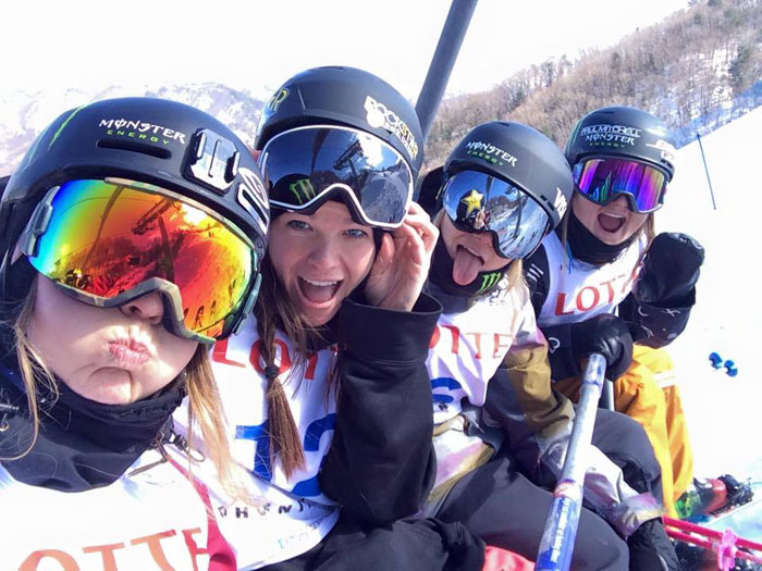 Keri Herman from the U.S. (second from left) and friends pose for a photo during the qualifications at the FIS Ski/ Snowboard World Cup on Feb. 18.